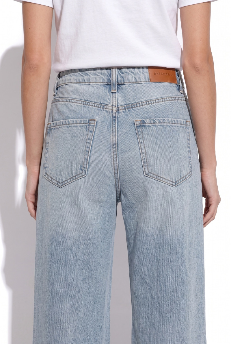 JEAN WIDE LEG CON ROTURAS JONES